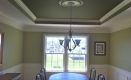 coordinating color accentuates tray ceiling